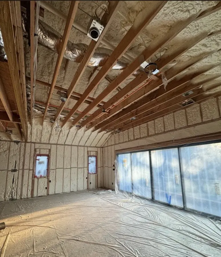 Interior walls and ceiling insulated with spray foam during new construction in Plano